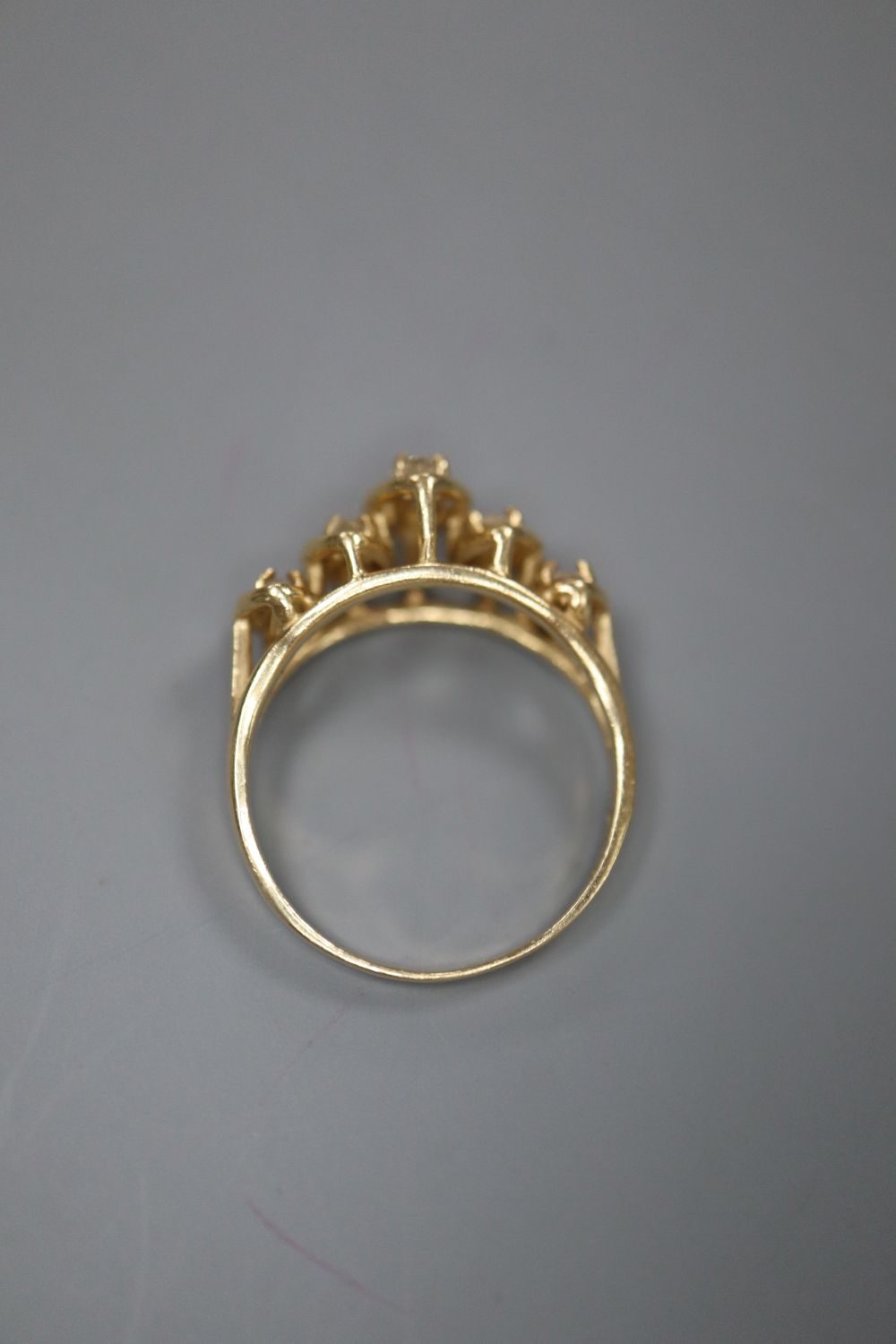 A modern 14k and graduated five stone marquise cut diamond half hoop ring, size M/N, gross 2.8 grams.